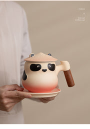 panda tea coffee cup in hand
