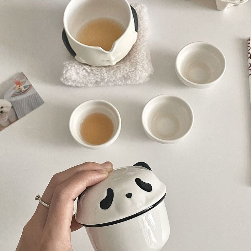 Panda teapot set top view with small tea cups