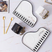 Piano key ceramic cup set overview with black and white color options