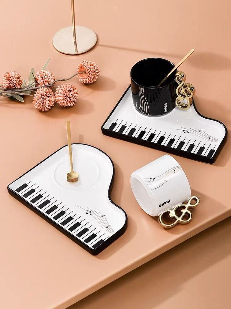 Styled gift scene with black and white Piano Key Tea Cup sets