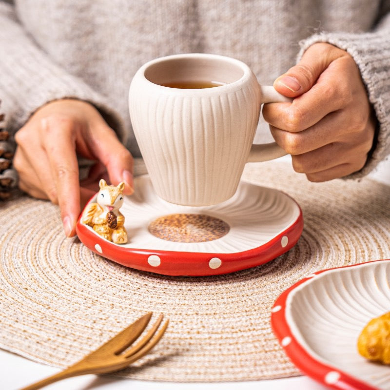 Red mushroom ceramic cup and saucer lifestyle scene